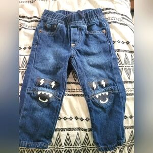 Baby gap jeans with dinasour knees.